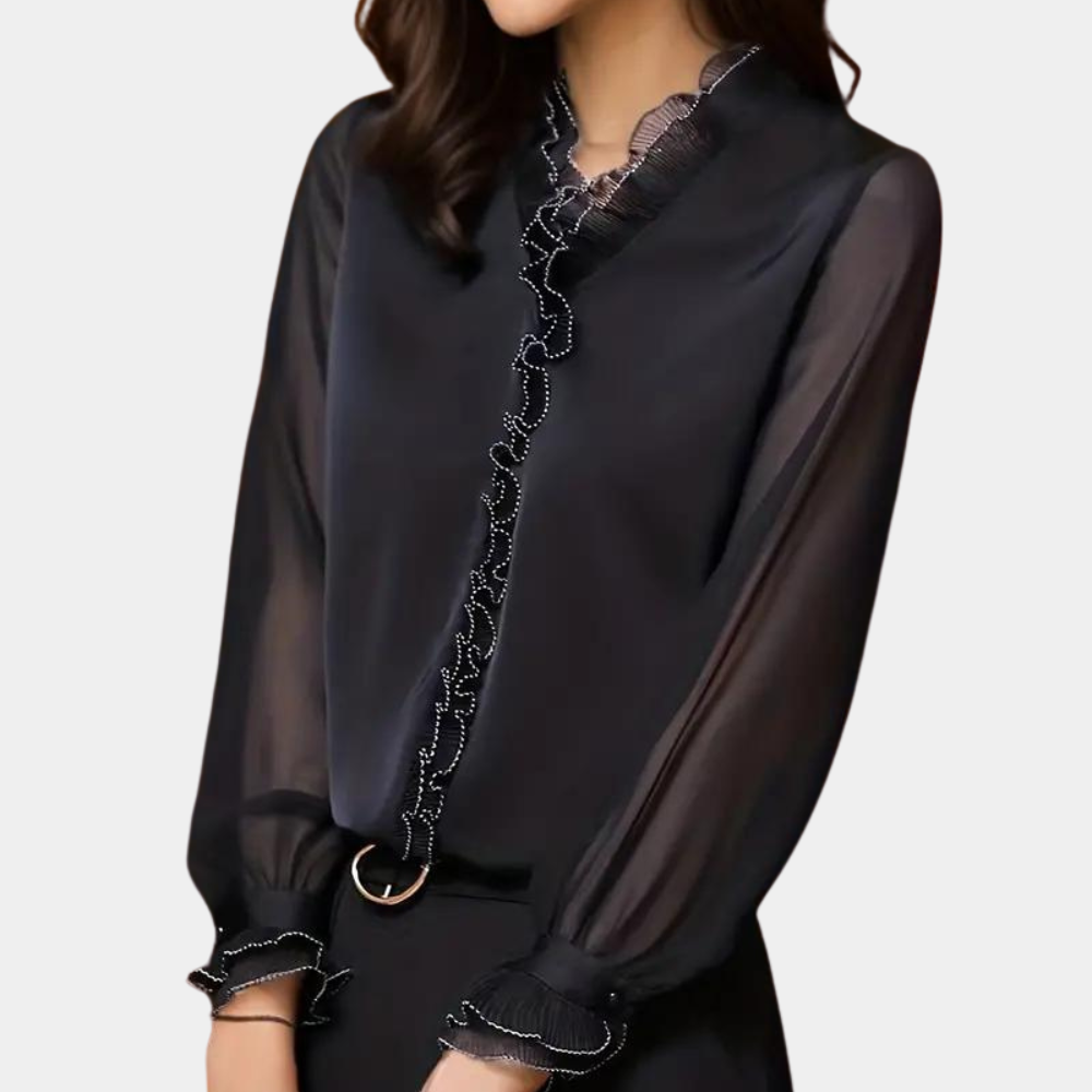 Zwarte damesblouse met lange mouwen, ruches en transparante details. Elegante blouse voor kantoor of avondkleding. Stijlvolle damesmode.