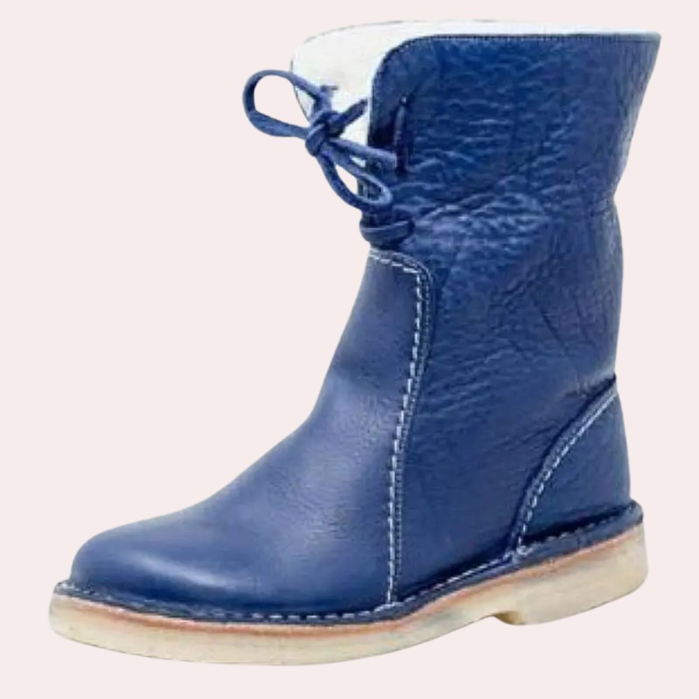 Blauwe leren laars met witte voering en veters, stevige zool. Stijlvolle winterlaars voor dames, ideaal voor koude seizoenen.