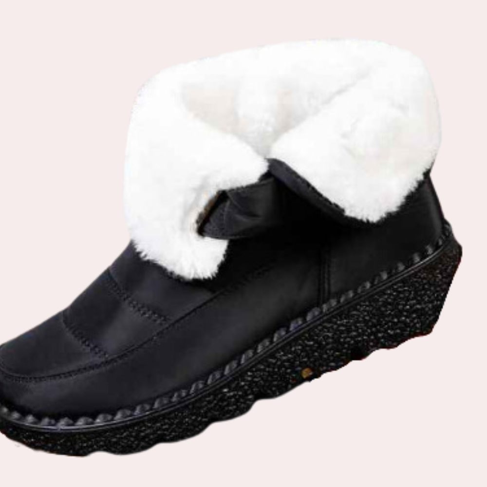 Zwarte dameslaars met witte bontkraag, comfortabele sleehak, wintermode, warme voering, stijlvol ontwerp, perfecte winterlaars.