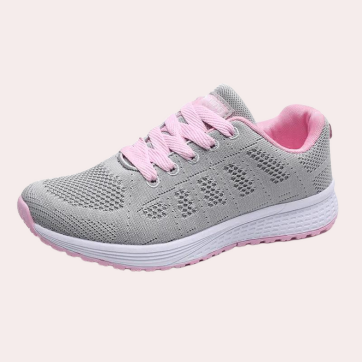 Grijze sportschoen met roze accenten, ademend mesh, lichtgewicht, comfortabele pasvorm, ideaal voor hardlopen en dagelijks gebruik.