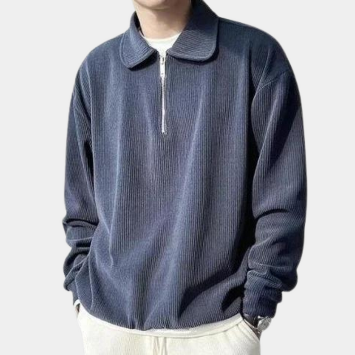 Donkerblauwe heren trui met ritssluiting, lange mouwen en geribbelde stof. Stijlvolle casual kleding voor mannen. Perfect voor herfst en winter.