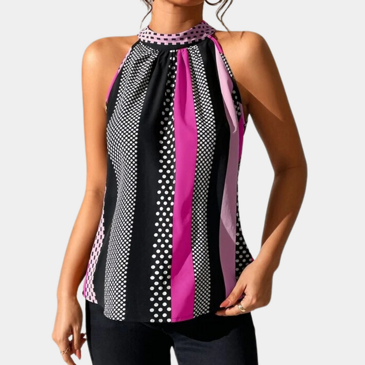 Dames haltertop met stippen en strepen in zwart, roze en wit. Modieuze zomerblouse, mouwloos, ideaal voor casual en chique gelegenheden.