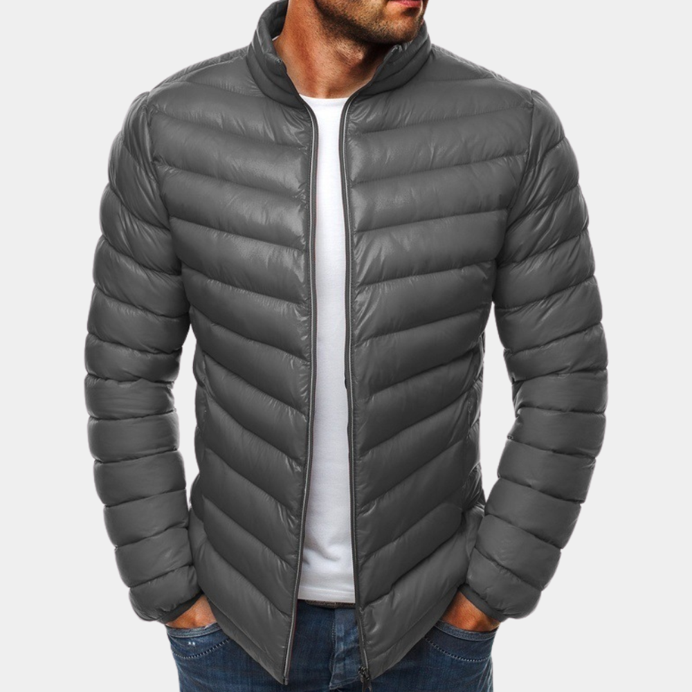 Grijze gewatteerde jas voor heren, modieus en warm, ideaal voor herfst en winter. Comfortabele pasvorm, perfect voor casual en outdoor activiteiten.