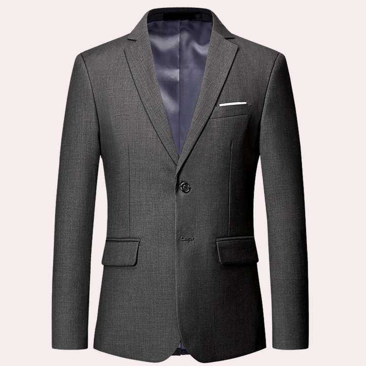 Grijs heren colbert met twee knopen, klassieke revers en borstzak. Perfect voor zakelijke en formele gelegenheden. Tijdloze stijl en elegantie.