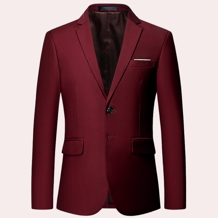 Bordeauxrode herenblazer met twee knopen, klassieke revers en borstzak. Perfect voor formele gelegenheden. Stijlvolle en elegante uitstraling.