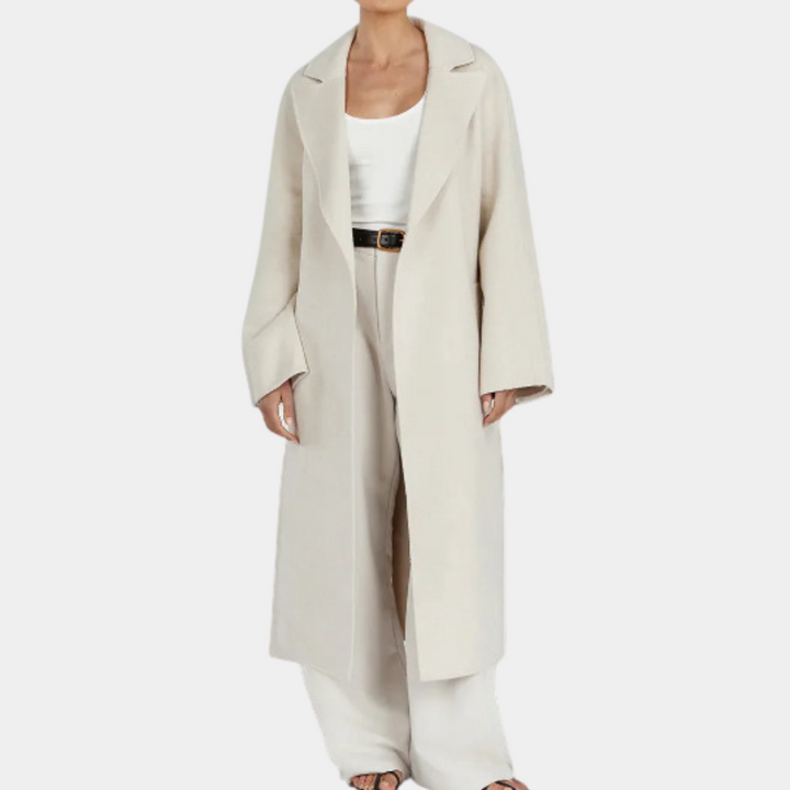 Dames lange crèmekleurige jas, minimalistisch design, open voorkant, geschikt voor herfst en winter. Stijlvolle en elegante damesmode.