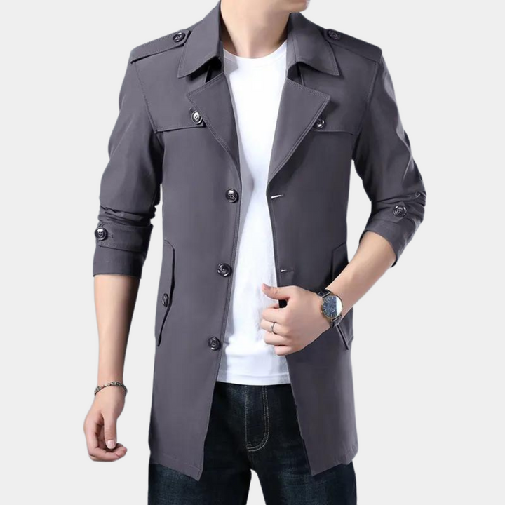 Grijze heren trenchcoat, lange mouwen, knoopsluiting, casual stijl, geschikt voor herfst en lente, modieuze jas voor mannen.