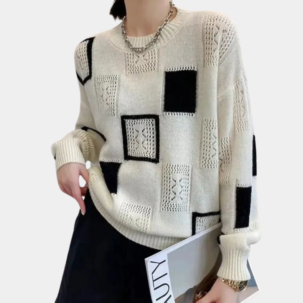Damestrui met zwart-wit geometrisch patroon, gebreid design, lange mouwen, casual stijl. Perfect voor herfst- en wintermode.