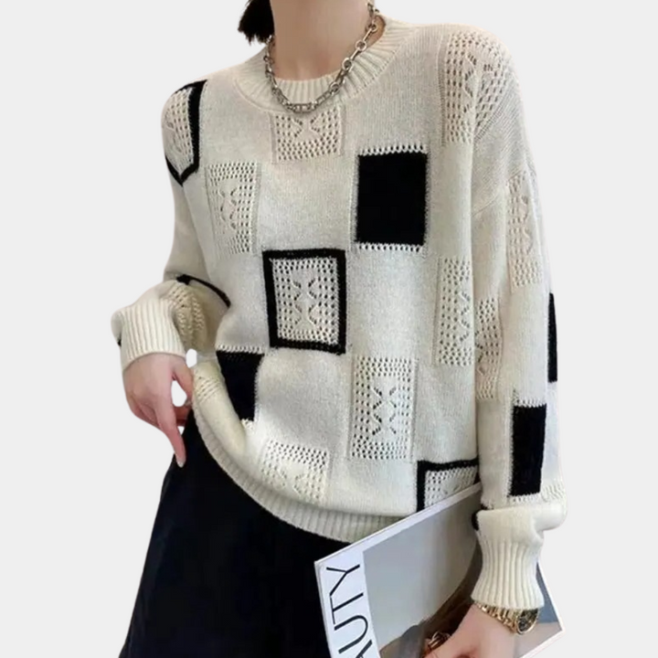 Damestrui met zwart-wit geometrisch patroon, gebreid design, lange mouwen, casual stijl. Perfect voor herfst- en wintermode.