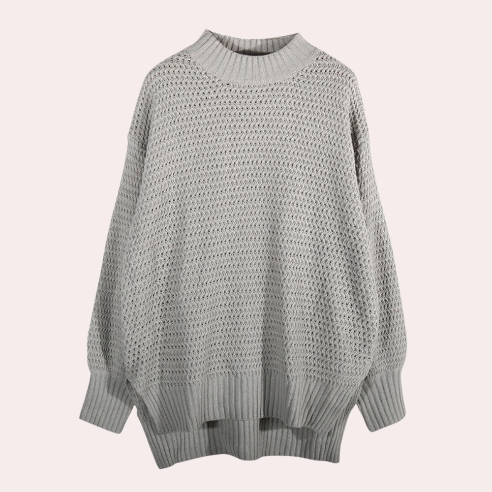 Grijze gebreide oversized trui met geribbelde kraag en manchetten, perfect voor herfst- en wintermode. Comfortabele en stijlvolle dameskleding.