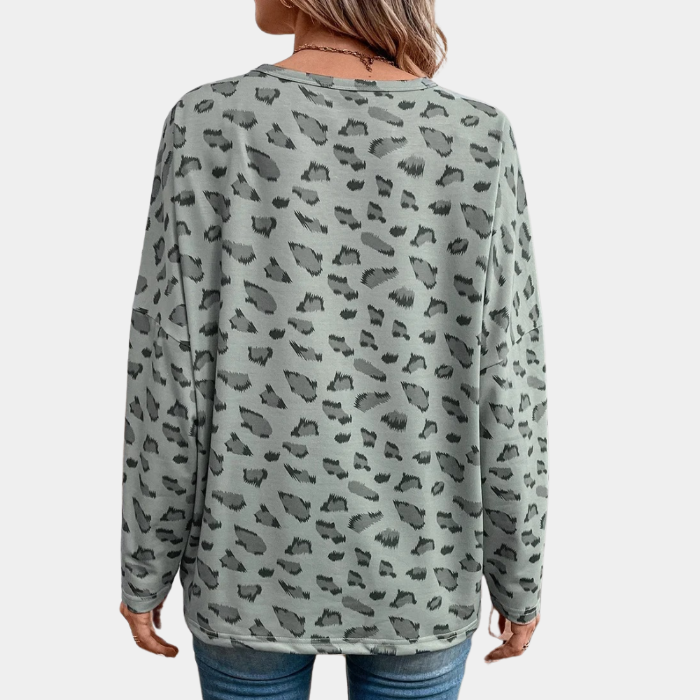 Grijze damestrui met luipaardprint, lange mouwen en ronde hals. Modieuze casual stijl, ideaal voor dagelijks gebruik. Comfortabele pasvorm.