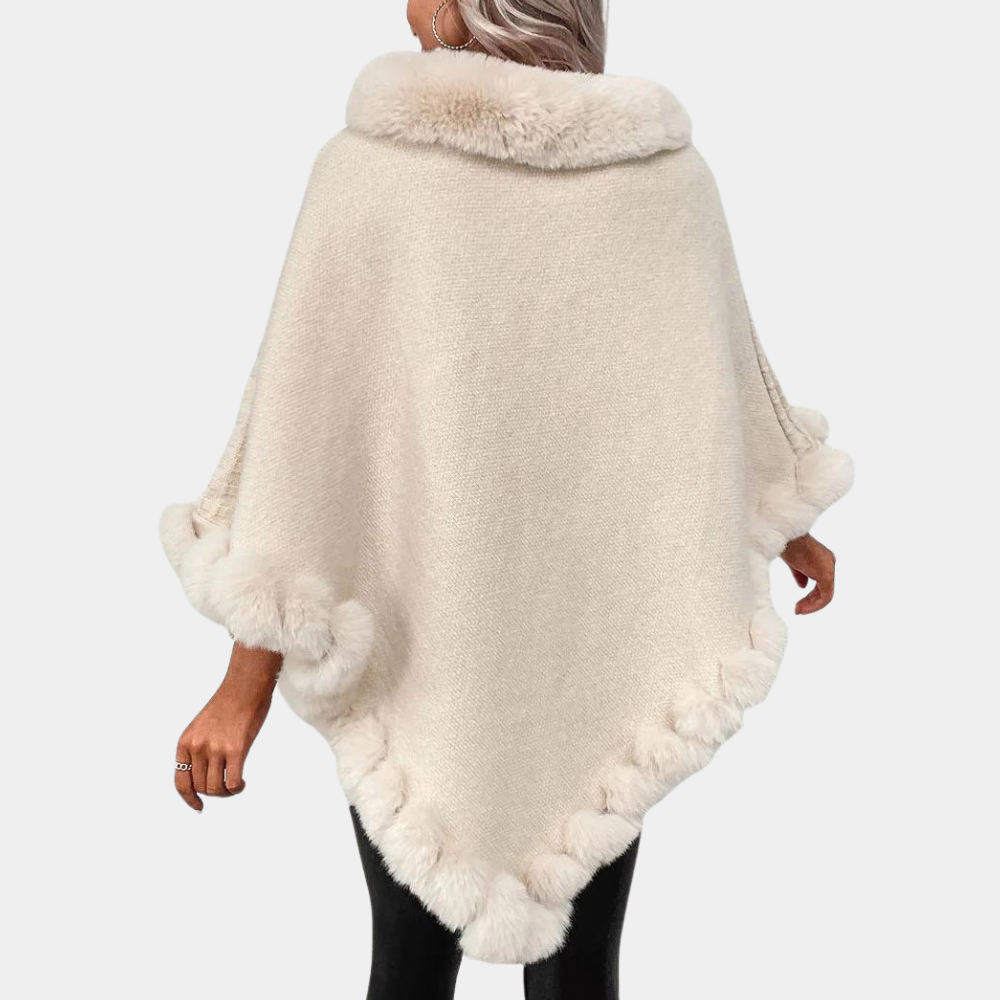 Dames poncho met bontkraag en rand, beige kleur, modieuze winterkleding, warme en stijlvolle cape, perfect voor koude seizoenen.