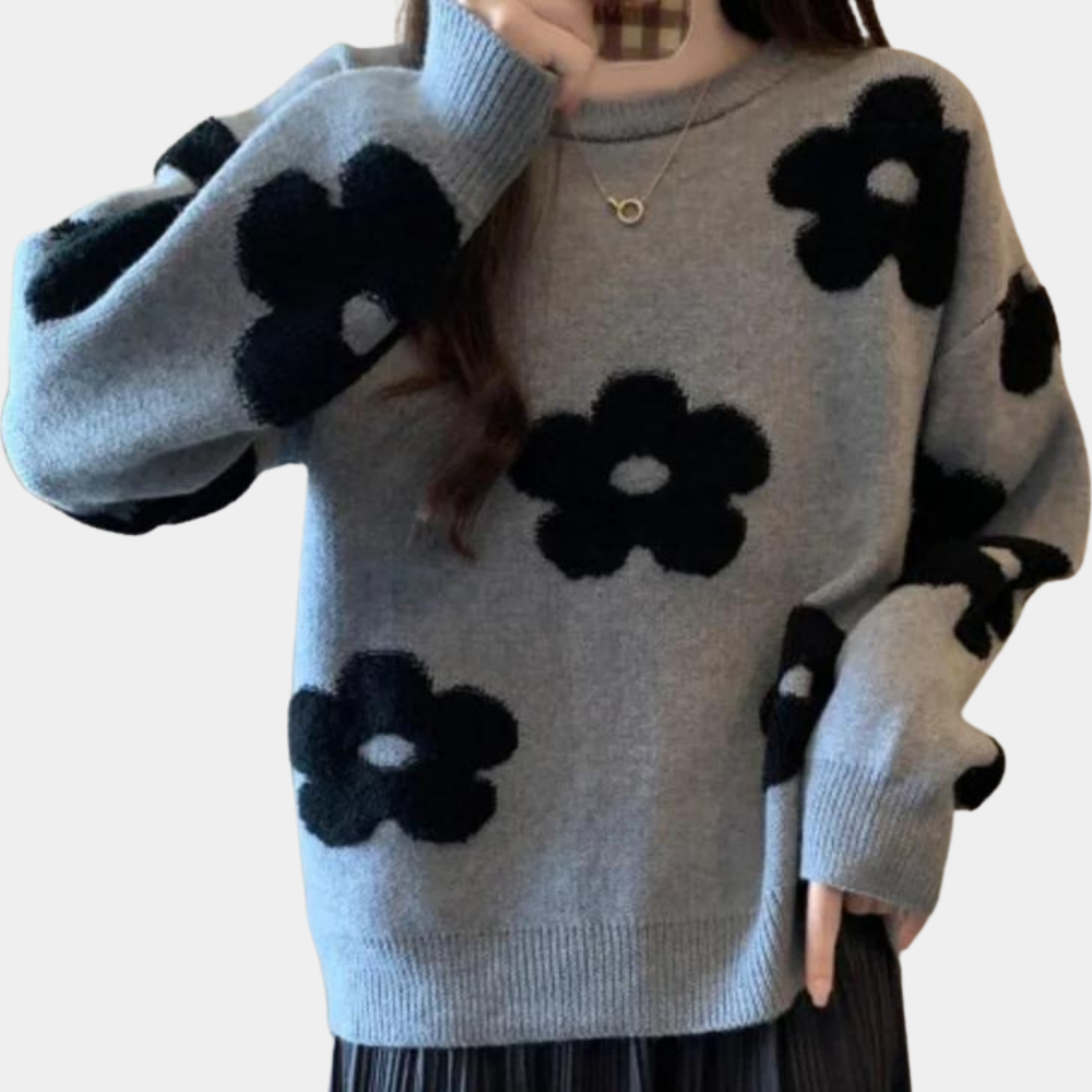 Grijze trui met zwarte bloemenprint, lange mouwen en ronde hals. Modieuze dameskleding, comfortabele pasvorm, trendy herfst- en winterstijl.