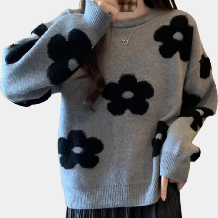 Grijze trui met zwarte bloemenprint, lange mouwen en ronde hals. Modieuze dameskleding, comfortabele pasvorm, trendy herfst- en winterstijl.