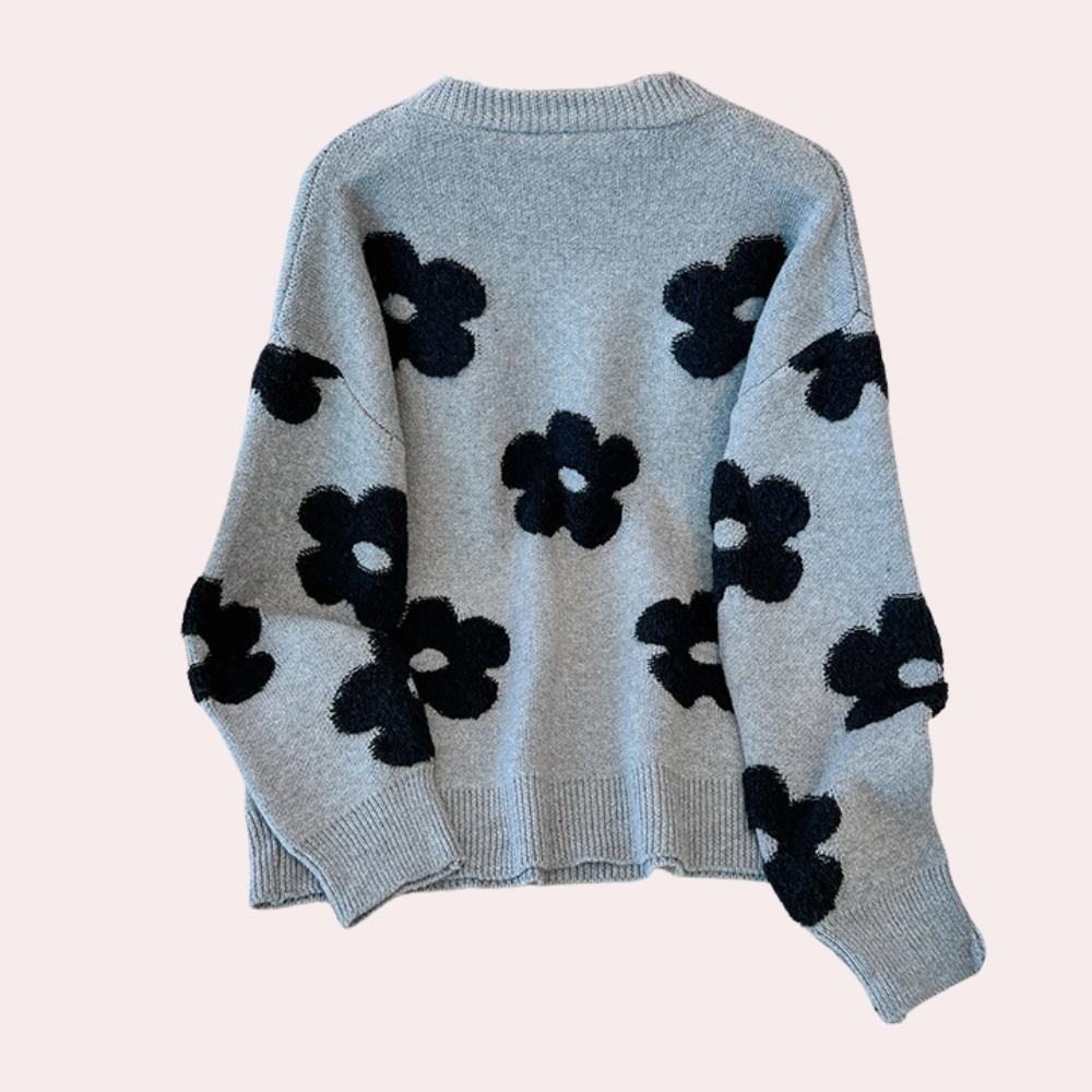 Grijze trui met zwarte bloemenprint, damesmode, gebreide sweater, trendy herfstkleding, comfortabele casual stijl, lange mouwen.