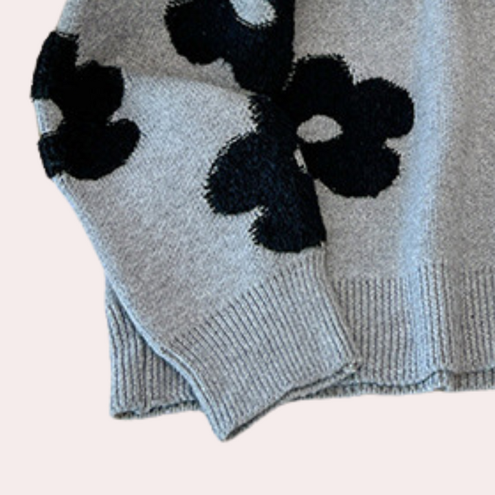 Grijze trui met zwarte bloemenprint, gebreid design, lange mouwen, casual stijl, geschikt voor herfst en winter, modieuze dameskleding.