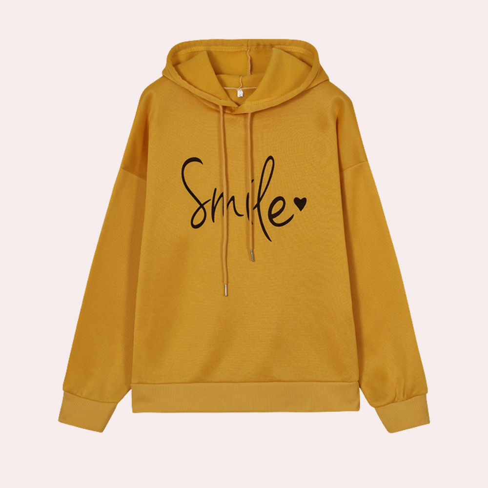 Gele hoodie met capuchon en opschrift "Smile" in zwarte letters, casual dameskleding, comfortabele trui, trendy mode, herfst- en winterstijl.