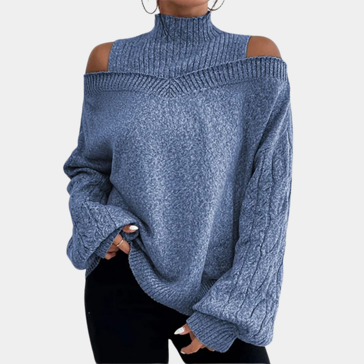 Blauwe damestrui met schouderuitsnijdingen, coltrui en kabelgebreide mouwen. Modieuze winterkleding, comfortabele pasvorm.
