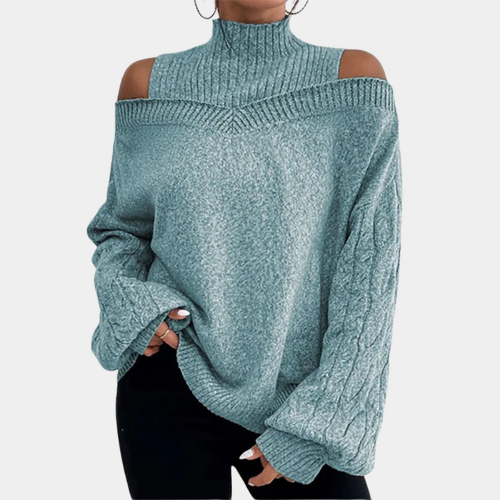 Damestrui met schouderuitsnijding in lichtblauw, gebreid patroon, hoge hals, lange mouwen. Modieuze winterkleding, comfortabele pasvorm.