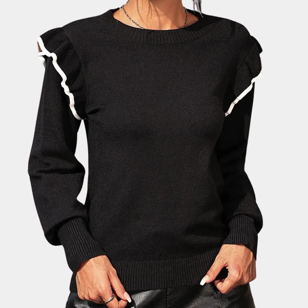 Zwarte damestrui met ruches en witte accenten, lange mouwen, ronde hals. Modieuze en elegante kleding voor herfst en winter.
