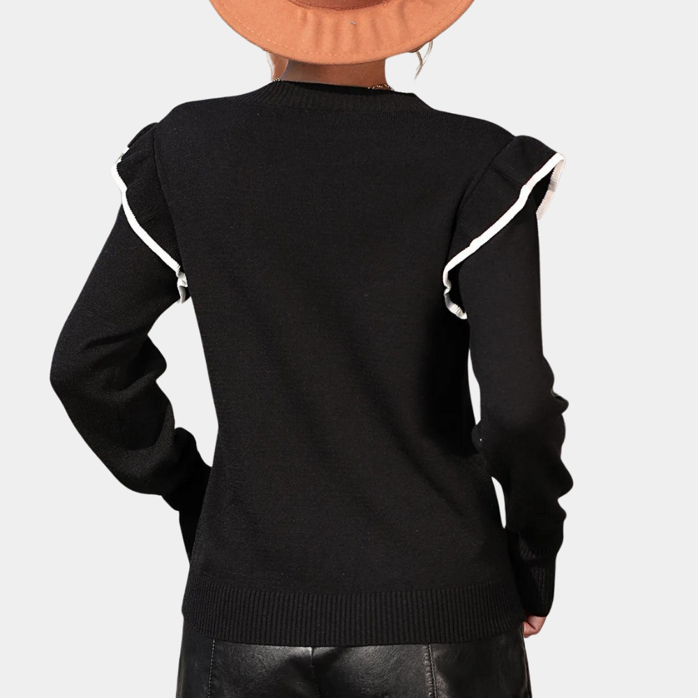 Zwarte damestrui met witte ruches, lange mouwen en ronde hals. Modieuze herfstkleding, perfect voor casual en chique outfits.