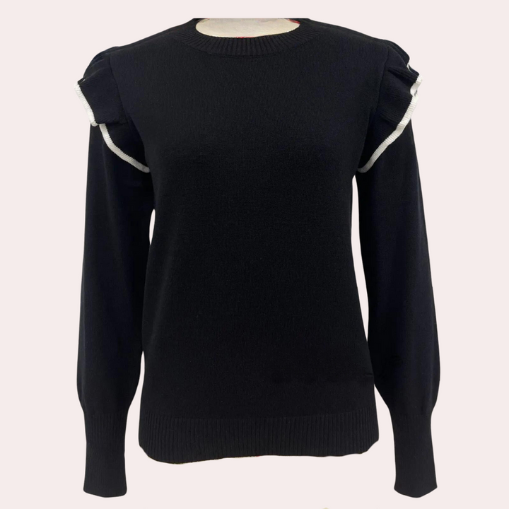 Zwarte damestrui met lange mouwen en ruches op de schouders, gemaakt van zachte stof. Perfect voor casual en stijlvolle outfits.