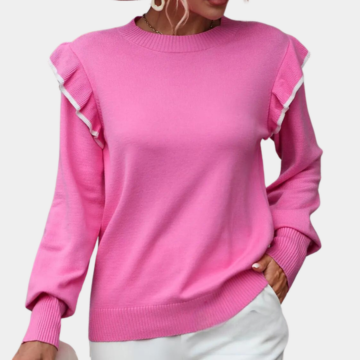 Roze damestrui met ruches, lange mouwen en ronde hals. Trendy en comfortabel, perfect voor casual en stijlvolle outfits.