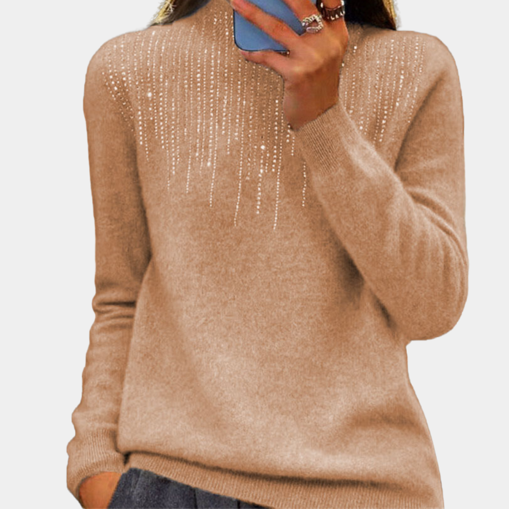 Damestrui in goudbruine kleur met glinsterende details, lange mouwen en ronde hals. Perfect voor herfstmode en casual chique outfits.