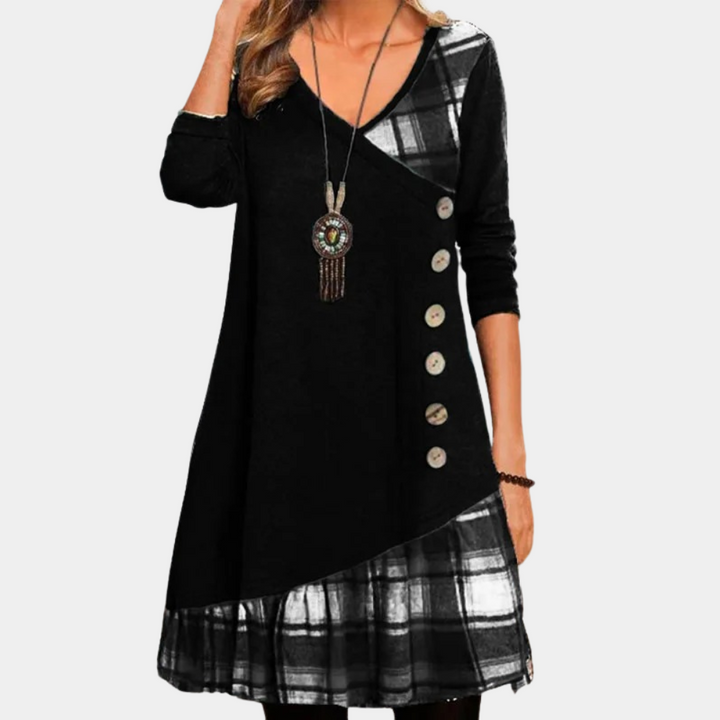 Zwarte damesjurk met asymmetrisch ontwerp, knopen en geruite details. Perfect voor casual en formele gelegenheden. Modieuze herfstkleding.