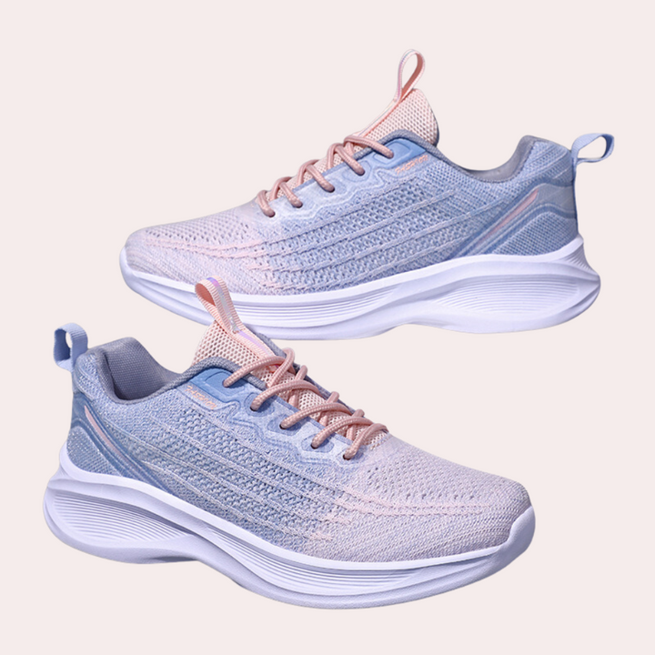 Paarse dames sneakers met roze accenten, lichtgewicht ontwerp, ademend mesh, comfortabele zool. Perfect voor sport en dagelijks gebruik.