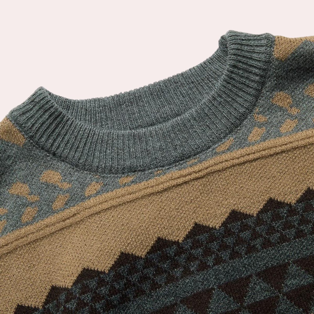 Grijze trui met geometrisch patroon en ronde hals, gemaakt van zachte stof. Perfect voor herfstmode en casual outfits. Unisex design.