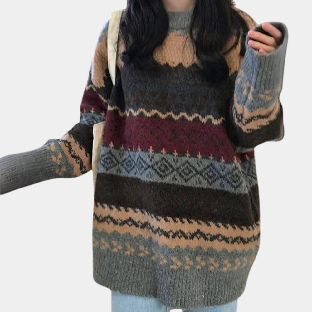 Grijze oversized trui met kleurrijk Noors patroon, lange mouwen en ronde hals. Perfect voor wintermode en casual outfits.