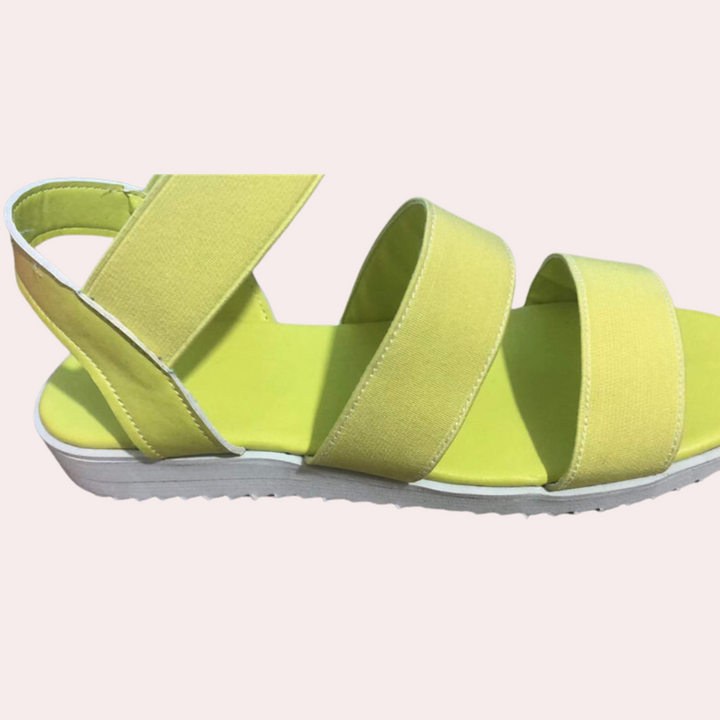Lichtgele dames sandaal met elastische banden en witte zool, zomerschoen, comfortabel design, casual stijl, perfect voor dagelijks gebruik.