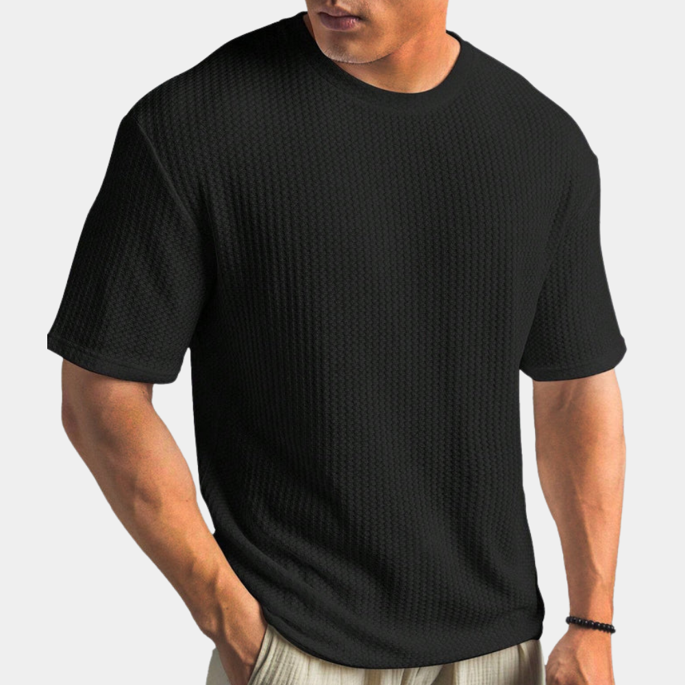 Zwarte heren T-shirt met textuur, korte mouwen en ronde hals. Comfortabele pasvorm, ideaal voor casual en stijlvolle outfits.