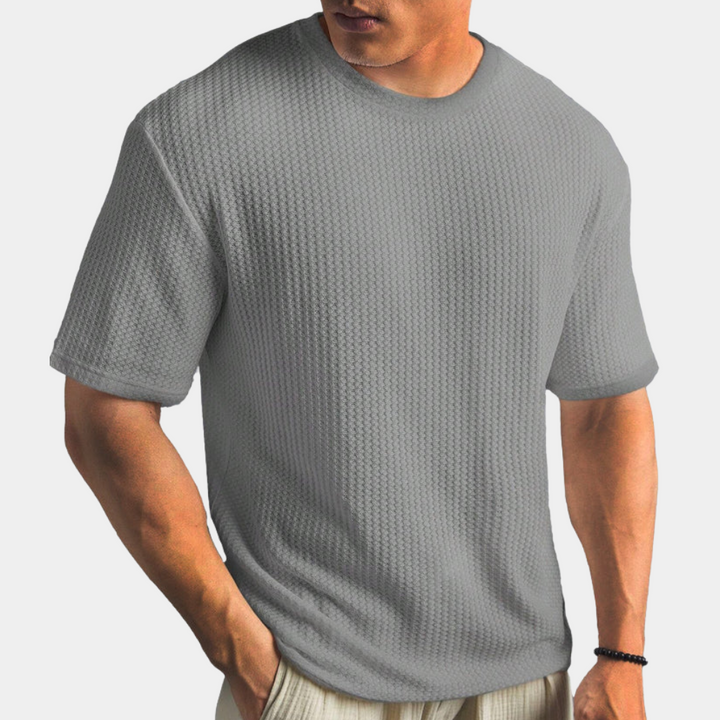 Grijs heren T-shirt met textuur, korte mouwen en ronde hals. Comfortabele pasvorm, ideaal voor casual outfits. Perfect voor dagelijks gebruik.