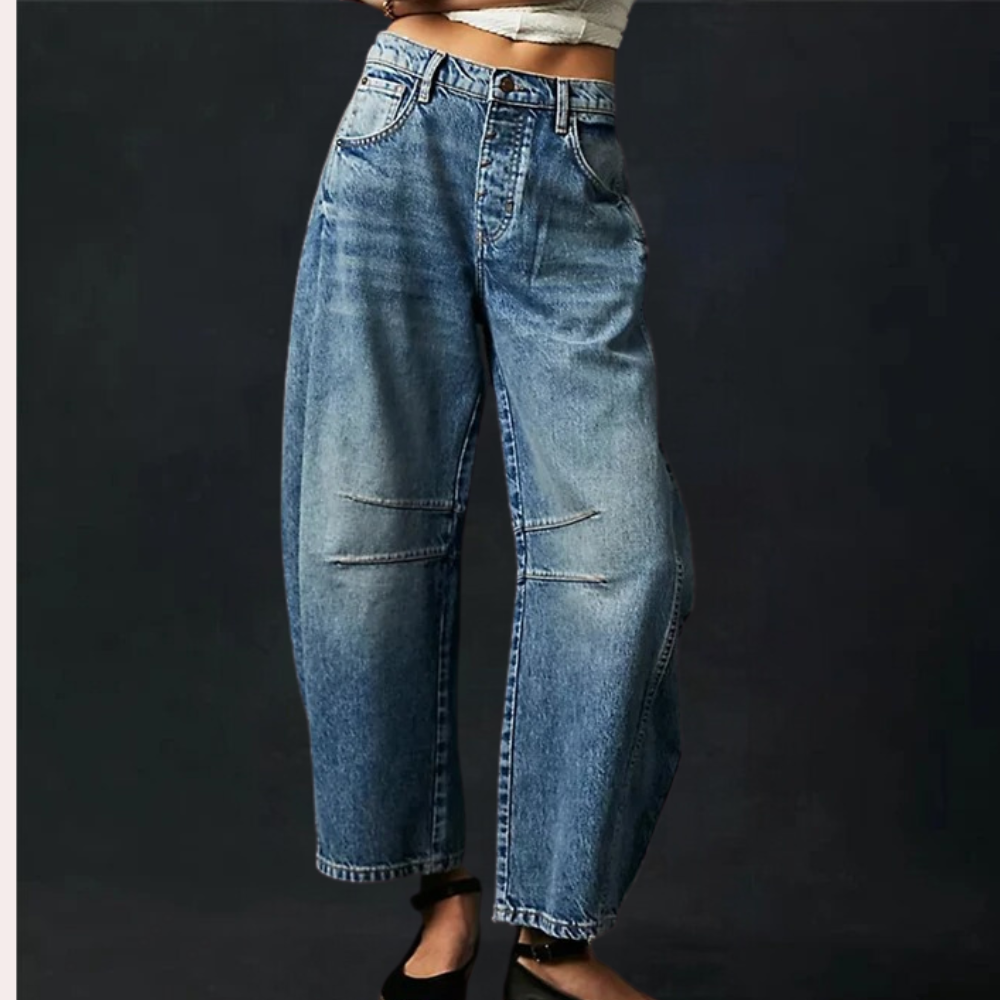 Donkerblauwe wijde jeans voor dames, hoge taille, vintage stijl, met opvallende stiksels en zakken, ideaal voor casual en modieuze outfits.