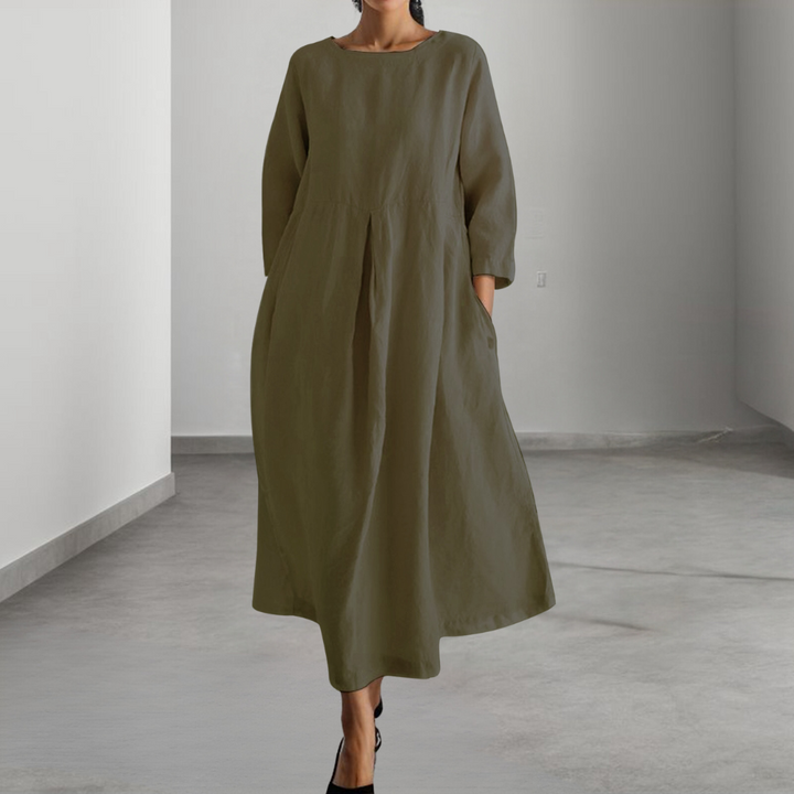 Groene linnen jurk met lange mouwen, minimalistisch design, comfortabele pasvorm, geschikt voor casual en formele gelegenheden, damesmode.
