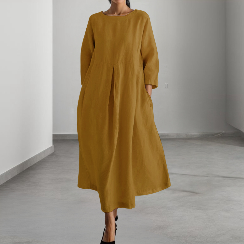 Gele linnen jurk met lange mouwen, minimalistisch ontwerp, comfortabele pasvorm, geschikt voor casual en formele gelegenheden, damesmode.