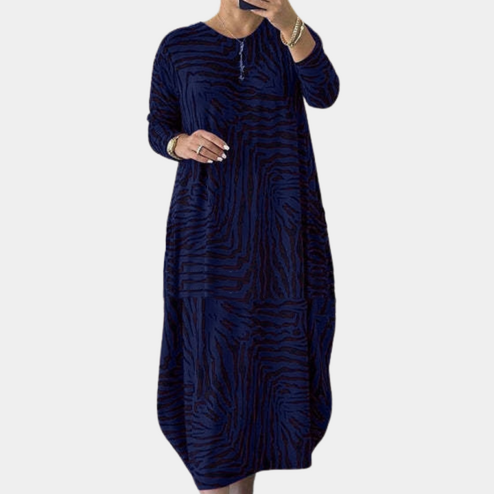 Blauwe damesjurk met lange mouwen en abstract patroon, comfortabele pasvorm, ideaal voor casual en formele gelegenheden. Trendy modekleding.