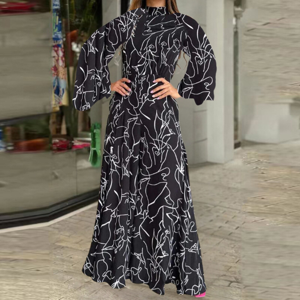 Zwarte maxi-jurk met abstracte witte lijnen, wijde mouwen en elegante pasvorm. Perfect voor modieuze dameskleding en avondkleding.