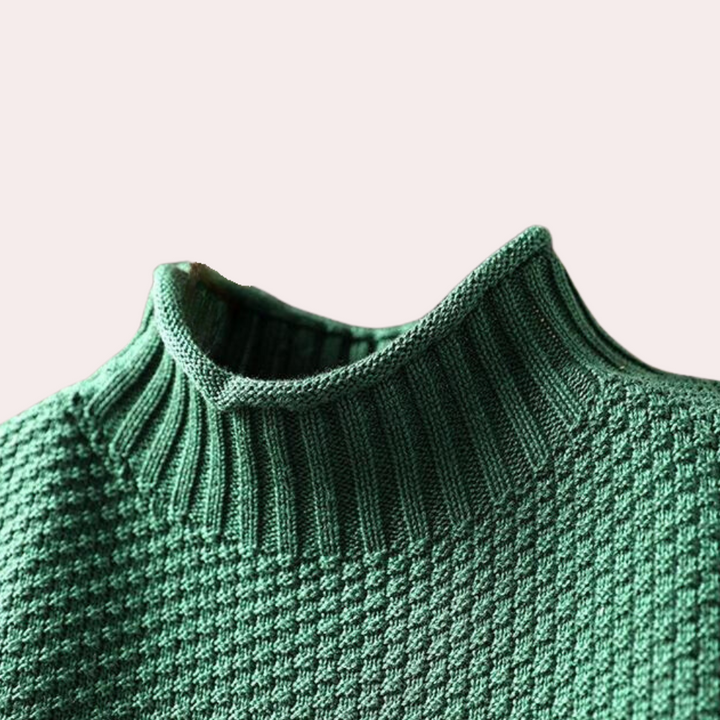 Groene gebreide trui met hoge kraag, honingraatpatroon, damesmode, herfstkleding, stijlvolle en warme trui, modetrend 2023.