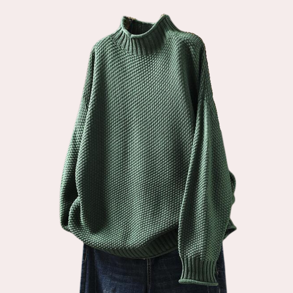 Groene gebreide trui met hoge kraag en losse pasvorm, perfect voor herfstmode. Comfortabele damestrui, ideaal voor casual en stijlvolle outfits.