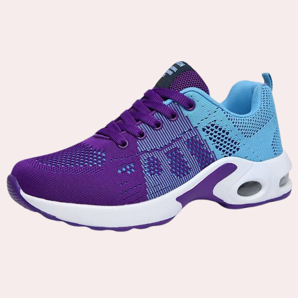 Paarse en blauwe sportschoen met ademend mesh, witte zool en paarse accenten. Ideaal voor hardlopen en fitness. Comfortabele en stijlvolle sneaker.