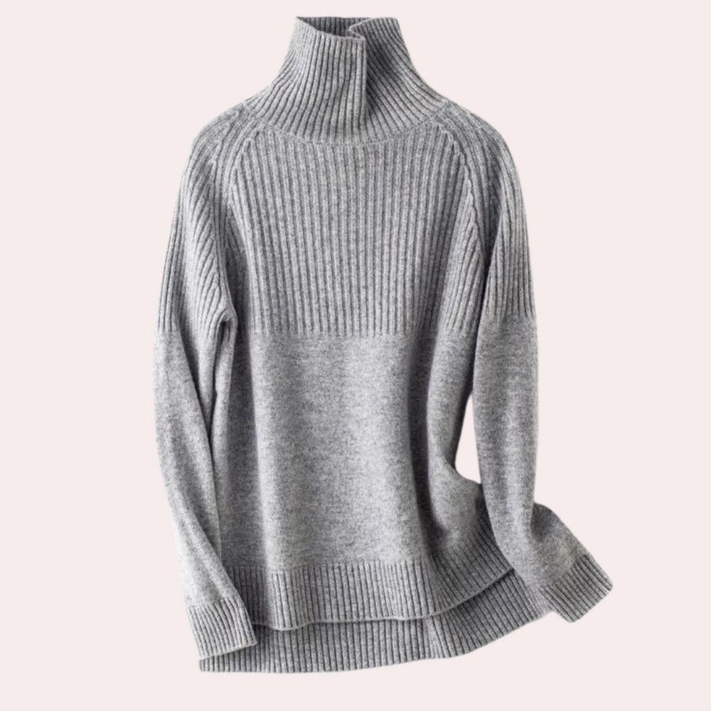 Grijze damestrui met hoge kraag, ribbelpatroon en lange mouwen. Stijlvolle en warme winterkleding, perfect voor casual en chique outfits.