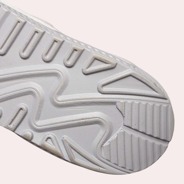 Witte rubberen sneakerzool met geometrisch patroon, antislip ontwerp. Ideaal voor sport- en vrijetijdsschoenen. Comfort en grip voor dagelijks gebruik.
