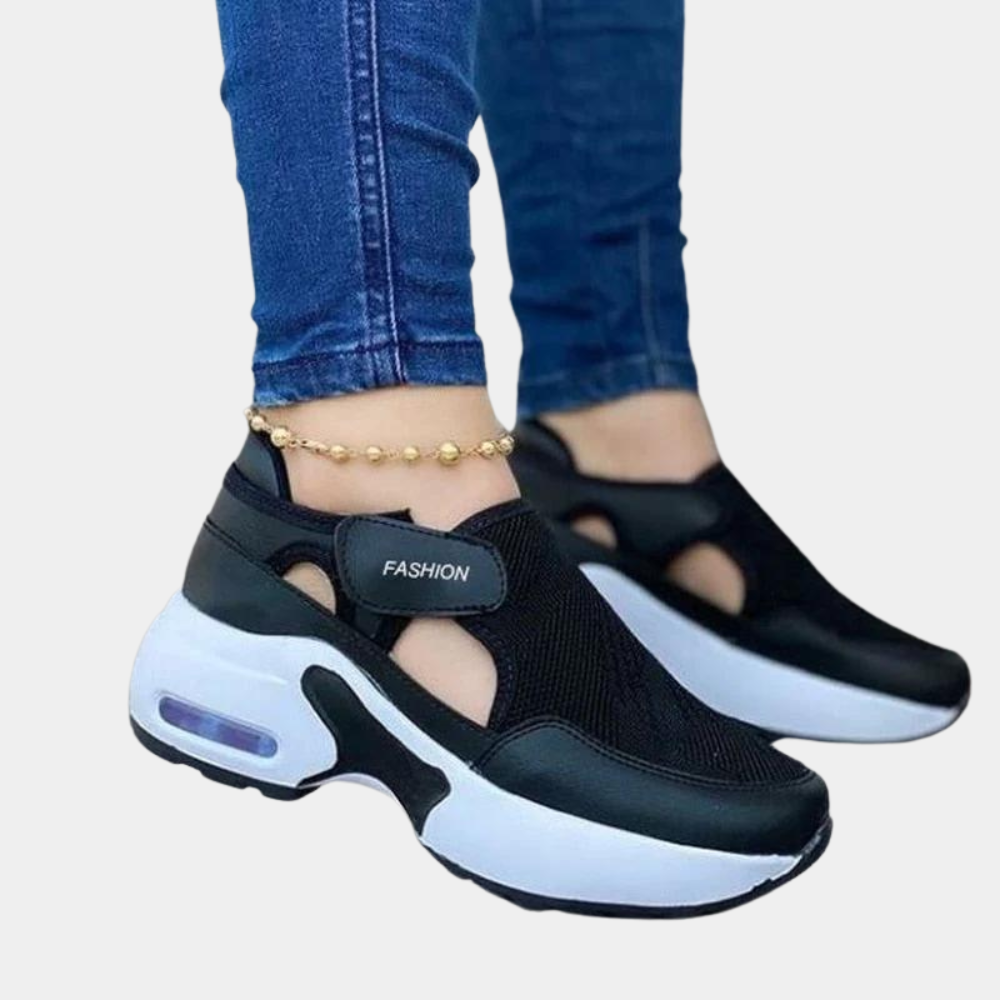 Zwarte dames sneakers met witte zool, ademend mesh, klittenbandsluiting, comfortabele sportieve schoenen, ideaal voor dagelijks gebruik.