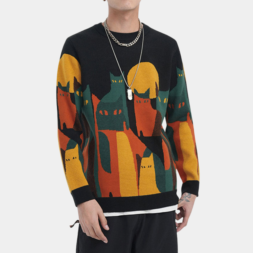Zwarte trui met kleurrijke kattenprint, gedragen door een man. Trendy herenkleding, opvallend design, geschikt voor casual en modieuze outfits.