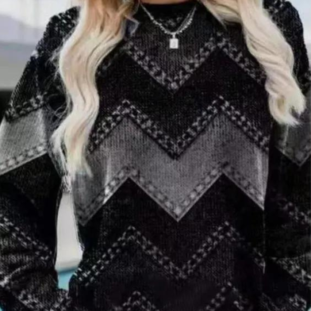 Zwart-wit gebreide trui met zigzagpatroon, gedragen door een vrouw. Modieuze damestrui, winterkleding, comfortabele en stijlvolle outfit.