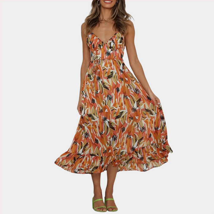 Oranje zomerjurk met bloemenprint, V-hals en spaghettibandjes. Perfect voor casual en strandoutfits. Trendy damesmode.