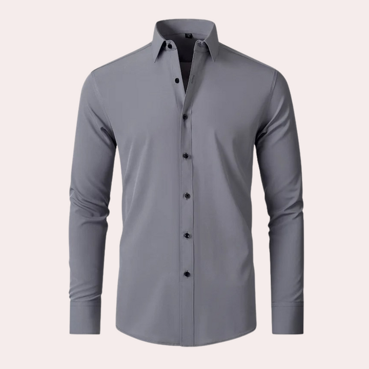 Grijze herenoverhemd met lange mouwen, klassieke kraag en zwarte knopen. Perfect voor zakelijke en casual gelegenheden. Stijlvol en modern design.